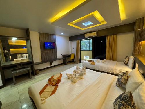 Ένα ή περισσότερα κρεβάτια σε δωμάτιο στο MrMac's Place