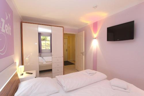 En eller flere senge i et værelse på strandnah, Ferienwohnung mit Sauna- und Schwimmbadnutzung - Strandresidenz Baabe FeWo1-29