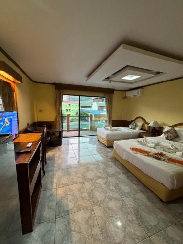 Ένα ή περισσότερα κρεβάτια σε δωμάτιο στο MrMac's Place