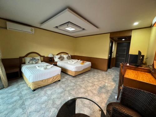 Ένα ή περισσότερα κρεβάτια σε δωμάτιο στο MrMac's Place