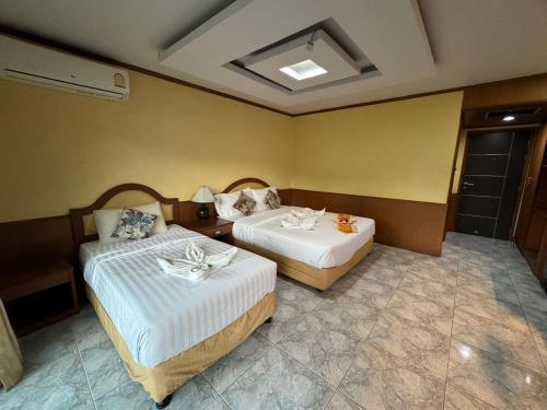 Ένα ή περισσότερα κρεβάτια σε δωμάτιο στο MrMac's Place
