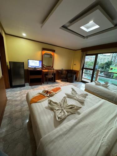 Ένα ή περισσότερα κρεβάτια σε δωμάτιο στο MrMac's Place