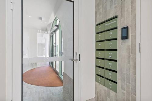a door leading into a hallway with a corridor at Bianca By The Beach is Paradise! in Gold Coast
