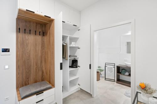 a room with white walls and a sliding door at Premium 24h SmartApart Modern mit Smarthome zentral-Welcome drink inkl in Tettnang