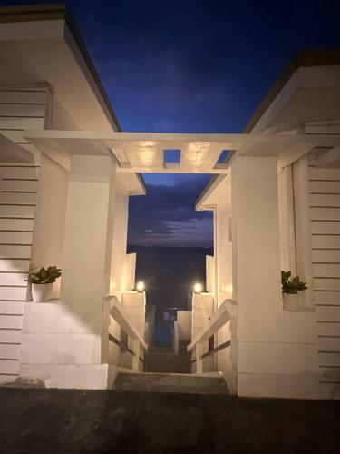 a view from the outside of a house at night at CasaDel Beach House in Mabini