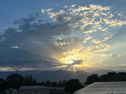 a cloudy sky with the sun in the background at Casco histórico Atenea in Comayagua