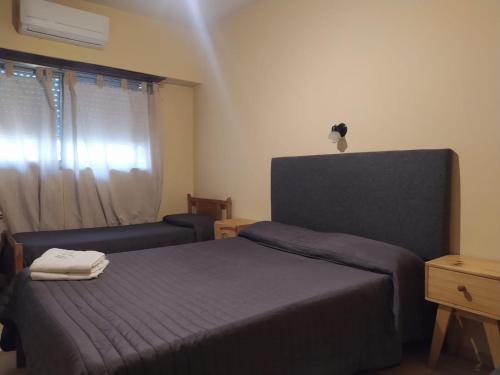 Ένα ή περισσότερα κρεβάτια σε δωμάτιο στο Hotel Manzanares Plaza