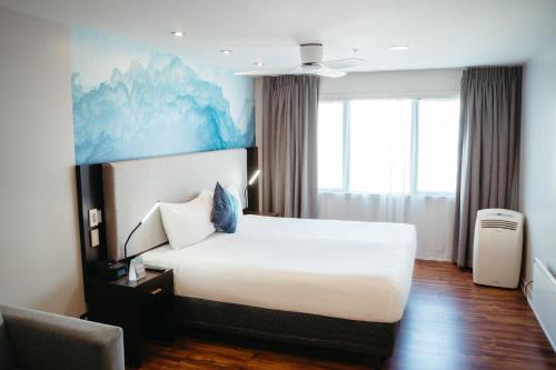 Ένα ή περισσότερα κρεβάτια σε δωμάτιο στο Auckland City Hotel - Hobson St