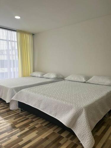 Ένα ή περισσότερα κρεβάτια σε δωμάτιο στο Exclusivo Apartamento amoblado
