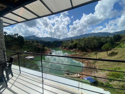 a view of a river from a balcony at Springfield Ecoloft- Guatapé in Guatapé