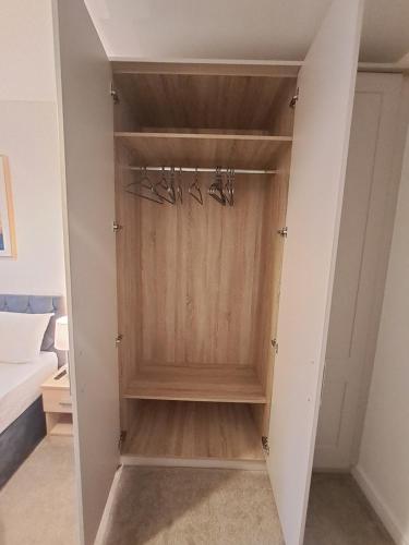 a walk in closet with three pairs of glasses at Cozy bedroom in Lucan, Dublin in Dublin