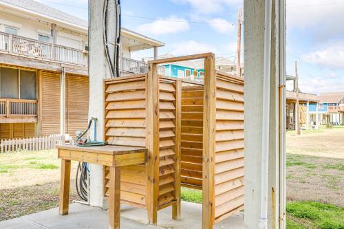a wooden desk with a laptop on top of it at Footprints in the Sand - Luxe Freeport Home! in Freeport