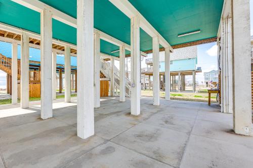 a building under construction with white columns at Footprints in the Sand - Luxe Freeport Home! in Freeport