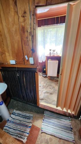 a room with a door that is under construction at Hospedajes Richie Eco Camp in Providencia