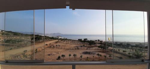 a view of a desert from a window at CASA DE PLAYA Durante todo el año in Punta Negra