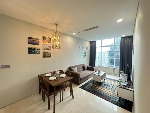 a living room with a table and a couch at Sky Suites KL City Center in Kuala Lumpur