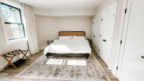 a bedroom with a bed and a window at Private Modern Luxury Suite in Historic Stone Home in Washington