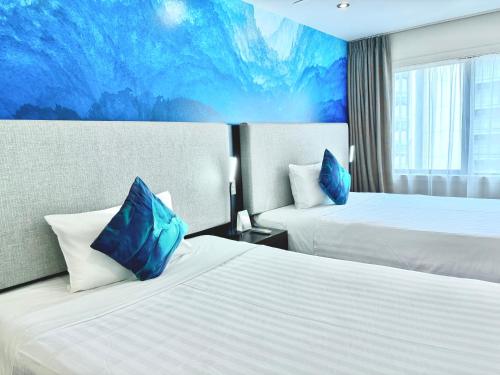 Ένα ή περισσότερα κρεβάτια σε δωμάτιο στο Auckland City Hotel - Hobson St