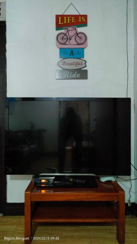 a large flat screen tv sitting on top of a table at Kochimoto Bed & Bath in Baguio