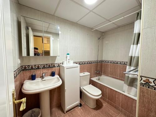 a bathroom with a sink and a toilet and a tub at Studio in Costa Del Sol, Sea, Sunshine & Views in Fuengirola