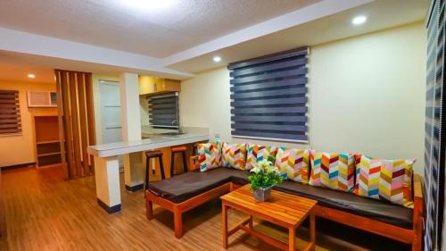 a living room with a couch and a table at Bakasyunan Resort and Conference Center - Zambales in Iba