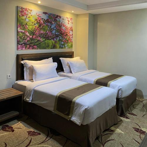 Travellers Hotel Phinisiにあるベッド