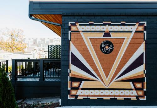 a painting on the side of a building at The Vinyl at Music Row - 1 Bedroom Apartment in Nashville