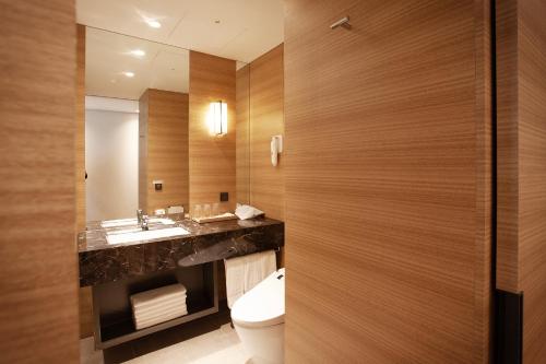 a bathroom with a toilet and a sink at Crown Park Hotel Seoul Myeongdong in Seoul