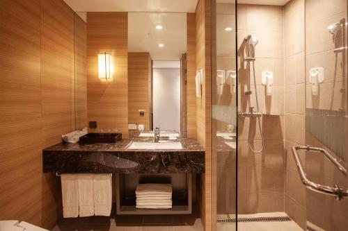 a bathroom with a sink and a shower at Crown Park Hotel Seoul Myeongdong in Seoul
