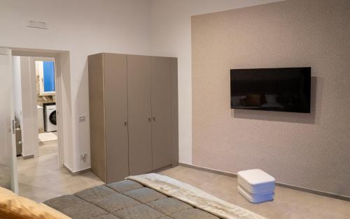 Télévision ou salle de divertissement dans l'établissement Incantonapoli