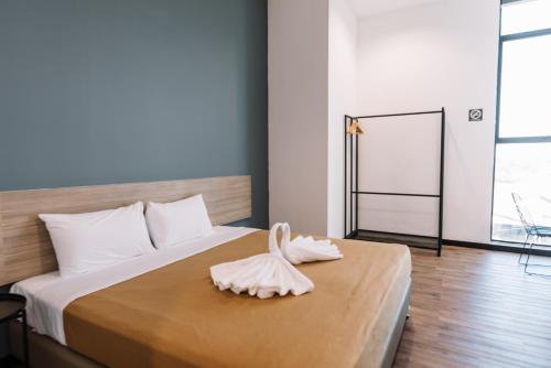 Ένα ή περισσότερα κρεβάτια σε δωμάτιο στο Urban Inn, Alor Setar