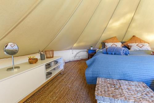 a bedroom with a bed in a tent at Forrest Holiday Park in Forrest