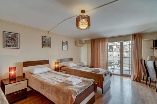 Postel nebo postele na pokoji v ubytování Liva Hotel