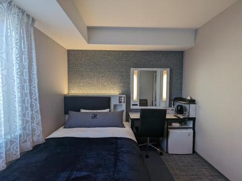 Postel nebo postele na pokoji v ubytování Green Rich Hotel Tokuyama Ekimae
