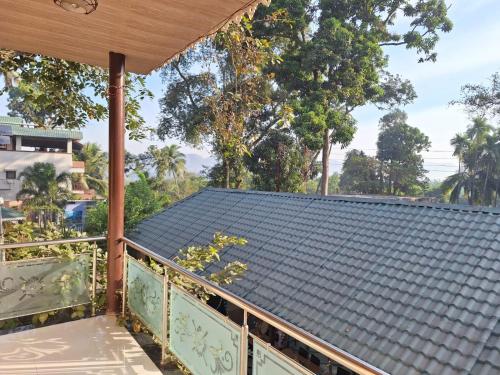 a view from the balcony of a house at Coastal Bay Inn by Green Apple Stays in Alibaug