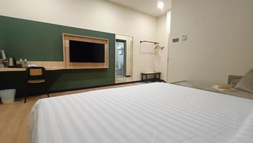Ένα ή περισσότερα κρεβάτια σε δωμάτιο στο Urban Inn, Alor Setar