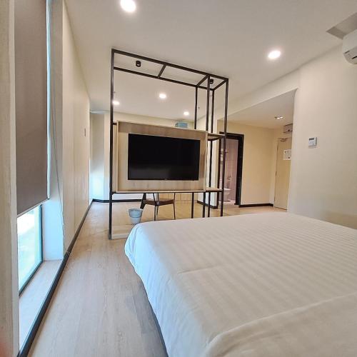 Ένα ή περισσότερα κρεβάτια σε δωμάτιο στο Urban Inn, Alor Setar