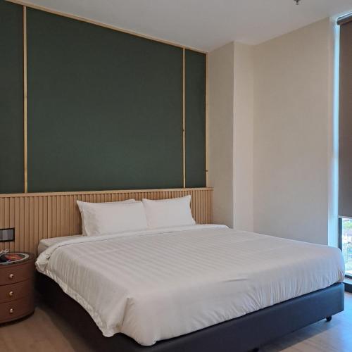 Ένα ή περισσότερα κρεβάτια σε δωμάτιο στο Urban Inn, Alor Setar