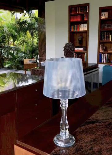a glass lamp sitting on top of a table at La Reserve 1785 Canggu Beach - Adults Only in Canggu
