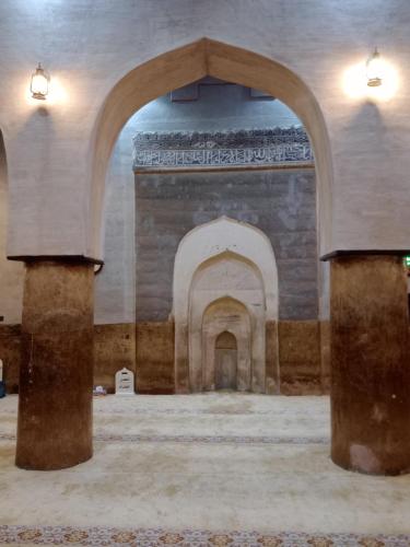 an empty room with an archway in a building at Riad Nizwa in Nizwa