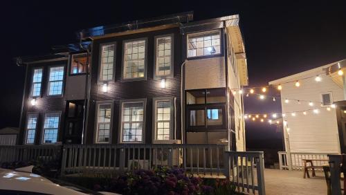 a building with a string of lights in front of it at Haumok52 Udo in Jeju