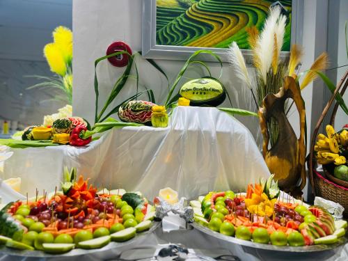 a buffet of fruits and vegetables on a table at Ocean Pearl Hotel Phu Quoc in Phu Quoc