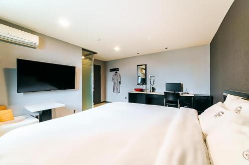 Postel nebo postele na pokoji v ubytování Hotel Ssome Jeongkwan