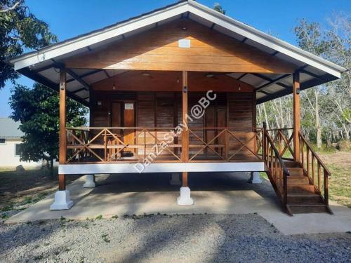 a large wooden pavilion with a porch and stairs at DanZaStay1@BC Nearby Thai Border in Padang Besar