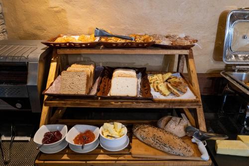 a group of different types of bread and other foods at Bar Peepal Resort in Pokhara