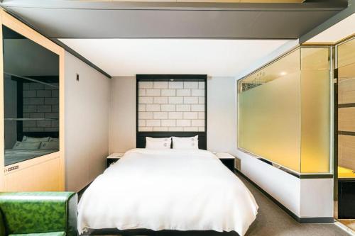 Postel nebo postele na pokoji v ubytování Hotel Ssome Jeongkwan