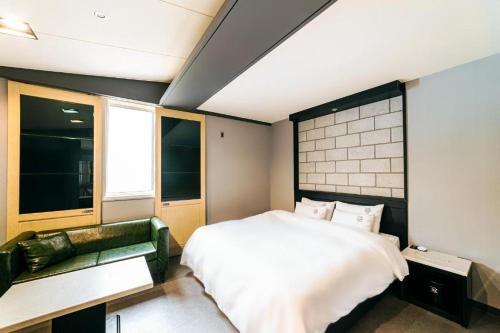 Postel nebo postele na pokoji v ubytování Hotel Ssome Jeongkwan