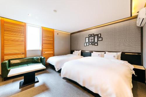 Postel nebo postele na pokoji v ubytování Hotel Ssome Jeongkwan