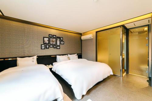 Postel nebo postele na pokoji v ubytování Hotel Ssome Jeongkwan