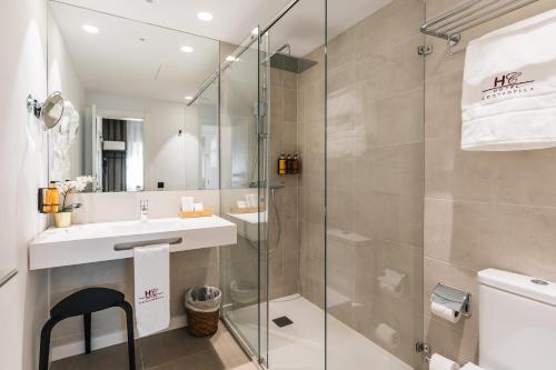 Ein Badezimmer in der Unterkunft Hotel Costabella